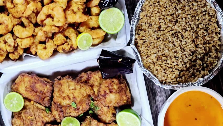 seafood dishes of Fried Epinephelus fish fillet, Fried shrimps, fish rice, and assorted seafood creamy soup of shrimps, squid, crabs, fish fillet, herbs, dill, garlic and onion, seafood mixture soup