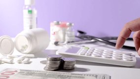 A physician sits at a desk using a calculator to analyze the costs and income of medical practice. Visuals reflect healthcare budgeting, financial planning, and operational cost management in clinics  - Powered by Shutterstock - Get 15% off with code: PIKWIZARD15