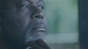 Senior investor gazing right, analyzing, watching financial orange line oscillating into glass bars. Finance, data analysis, technology, professional, analytics, concentration, innovation - Powered by Shutterstock - Get 15% off with code: PIKWIZARD15