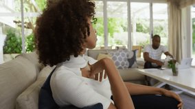 after two seconds woman leaning, man typing as social media hearts drifting around them on sofa. Romance, affection, intimacy, cozy, warmth, connection, relaxation - Powered by Shutterstock - Get 15% off with code: PIKWIZARD15