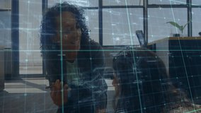 Grid overlay appearing in office initiating mentor gesturing to mentee tapping tablet and noting. Collaboration, innovation, technology, office, teamwork, digital, professional - Powered by Shutterstock - Get 15% off with code: PIKWIZARD15