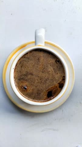 Subang June 26, 2025, Stirring pure black coffee in a cup