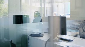 Man initiating headset call at business desk, generating animated shopping cart and chart icons. Technology, communication, data, digital, collaboration, analytics, network - Powered by Shutterstock - Get 15% off with code: PIKWIZARD15