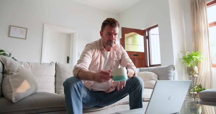 Senior man walking through front door at home, wearing casual shirt. lifestyle, doorway, entrance, domestic