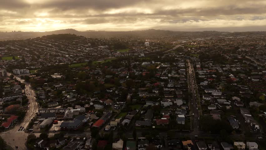 Cinematic aerial footage captured during the evening over Avondale, a quiet suburban neighbourhood in Auckland, New Zealand.