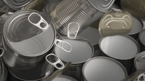Shimmering aluminum can tops fill the frame as a rotating top-down camera slowly spins to reveal reflective metal and polished industrial symmetry. - Powered by Shutterstock - Get 15% off with code: PIKWIZARD15
