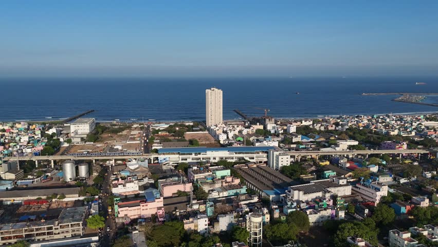 Drone shot capturing dense urban landscape of North Chennai in evening light