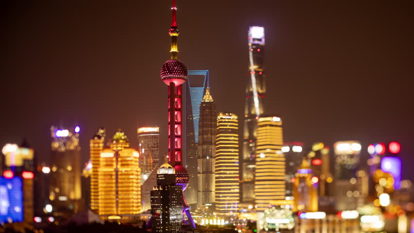 SHANGHAI, CHINA - 11 JUNE 2025 : Timelapse of the Shanghai city skyline from a high vantage point at night 