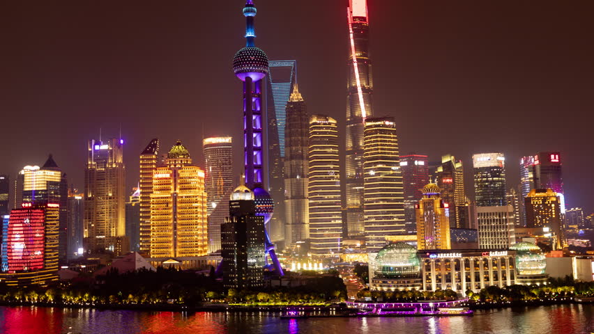 SHANGHAI, CHINA - 11 JUNE 2025 : Timelapse of the Shanghai city skyline from a high vantage point at night 