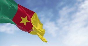 Cameroon national flag waving in the wind. Three vertical stripes of green, red, and yellow, yellow star in the center. Seamless 3d render animation. Slow motion loop. Selective focus - Powered by Shutterstock - Get 15% off with code: PIKWIZARD15