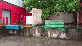 Close-up zoom in on green metal loading dock platform with peeling paint and water stains - Powered by Shutterstock - Get 15% off with code: PIKWIZARD15