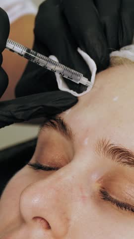 Beauty injection. anti-aging injections. botulinum therapy. Facial rejuvenation. Doctor is making beauty injections. collagen injections. Beauty concept.