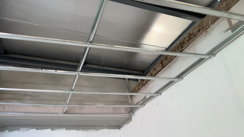 House renovation shows major interior construction progress. detailed look at ceiling framework and careful electrical wiring installation for new home design.