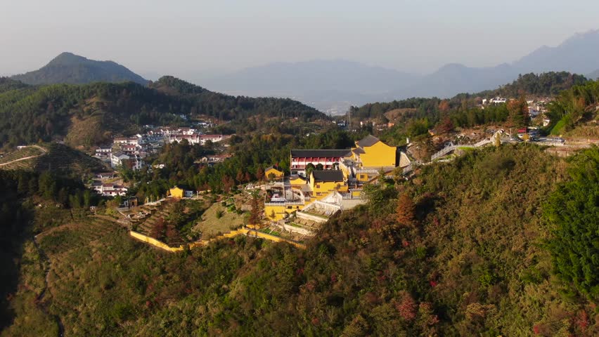 Explore the breathtaking aerial perspectives of Jiu Huashan Scenic Area, featuring the tranquil Pure Precepts Zen Garden set against stunning mountain backdrops.