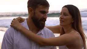 Happy young albanian couple having tender moment together on the beach during sunset - Travel, vacation and relationship concept  - Powered by Shutterstock - Get 15% off with code: PIKWIZARD15