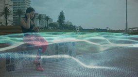 woman adjusting earbud clip then tapping smartphone screen and generating audio technology waveform. Casual, urban, modern, futuristic, digital, wellness, connectivity - Powered by Shutterstock - Get 15% off with code: PIKWIZARD15