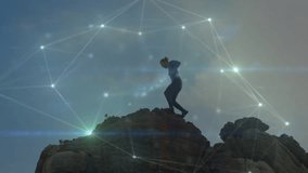 male hiker stepping onto rocky summit and activating glowing network overlay for tech visualization. Adventure, exploration, illumination, technology, mountain, wilderness, innovation - Powered by Shutterstock - Get 15% off with code: PIKWIZARD15