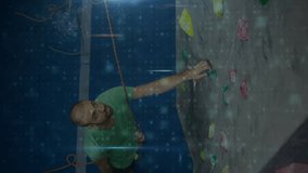 Male climber ascending rock wall initiating AR cybersecurity overlay scanning malware threats. Adventure, technology, innovation, training, sport, digital, athletic - Powered by Shutterstock - Get 15% off with code: PIKWIZARD15