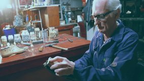 Senior cobbler picking up leather shoe and brush starting polishing bringing shine in workshop. Craftsman, craftsmanship, artisan, workshop, manual, detailed, vintage - Powered by Shutterstock - Get 15% off with code: PIKWIZARD15