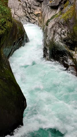 Aerial of a river in Norway. Vertical Video.