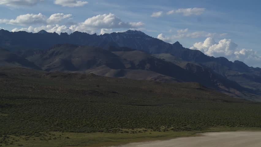 Aerial of Alvorod Desert dry lakebed and Steens Mountain in East Oregon in spring