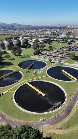  Vertical aerial view of a sanitation industry showing treatment tanks, infrastructure, and clean water processes from above