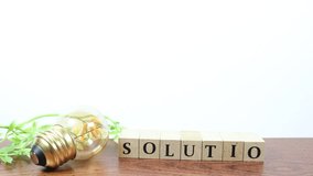 A light bulb and the word SOLUTON, representing inspiration and solutions. - Powered by Shutterstock - Get 15% off with code: PIKWIZARD15