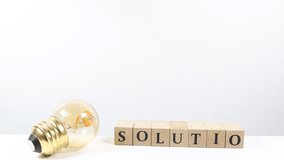 A light bulb and the word SOLUTON, representing inspiration and solutions. - Powered by Shutterstock - Get 15% off with code: PIKWIZARD15