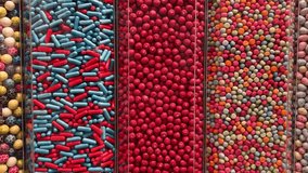 colorful candy sweet jelly in a glass jar displaying at candy shop  - Powered by Shutterstock - Get 15% off with code: PIKWIZARD15