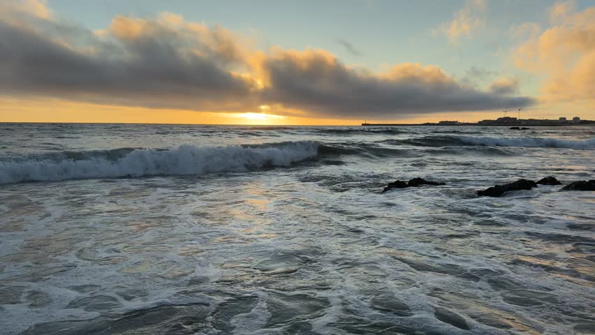 Sunset over Atlantic Ocean,Praia de Árvore, Portugal