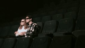 Couple enjoys a cozy moment in an empty theater while wearing 3D glasses - Powered by Shutterstock - Get 15% off with code: PIKWIZARD15