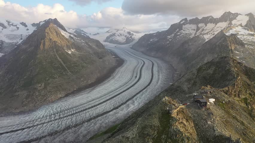 Aletsch Glacier in Summer seen from the Eggishorn just after sunrise in the Swiss Alps with the Jungfraujoch in the background, Valais, Switzerland
