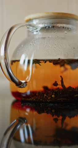 tea is brewed in a glass teapot, evaporation drops on the walls of the teapot