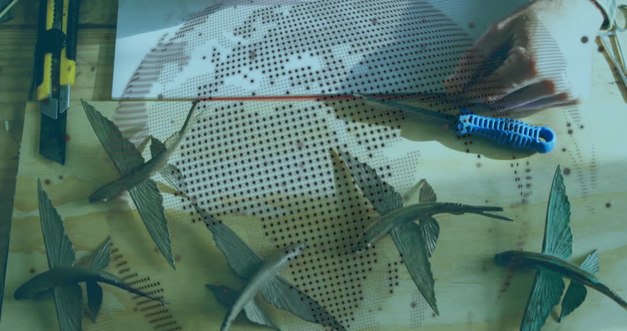 Craftsperson aligning map stencil, marking and perforating red dots across Africa for education. Artisan, craft, design, precision, workshop, creativity, themed