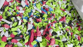 Disposable foam foam scraps of various colors, close-up, slow motion - Powered by Shutterstock - Get 15% off with code: PIKWIZARD15