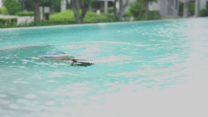 Asian boy swimming in a pool.4k