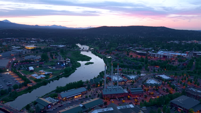 Drone shot of Old Mill District with restaurants and businesses in Bend, Oregon.