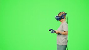 The girl wearing VR headset gaming virtual reality in scares game.The woman in virtual reality on chroma key green screen turn around in fear and surprise.Concept fear game VR headset virtual reality - Powered by Shutterstock - Get 15% off with code: PIKWIZARD15