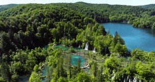 Plitvice Lakes National Park - Terraced Turquoise Lakes And Cascading Waterfalls Surrounded By Dense Green Forests. aerial orbiting shot - Powered by Shutterstock - Get 15% off with code: PIKWIZARD15