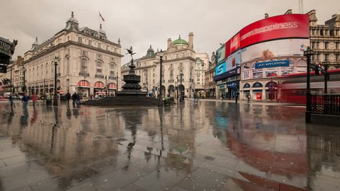 LONDON, UNITED KINGDOM - APRIL 12: People and vehicles cross the Piccadilly Circus in London on April 12, 2013. Piccadilly Circus is a major traffic junction and a tourist attraction.