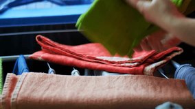 Organizing Clean Laundry: Person Folds Vibrant, Soft Towels for Tidy Home Storage - Domestic Chores - Powered by Shutterstock - Get 15% off with code: PIKWIZARD15