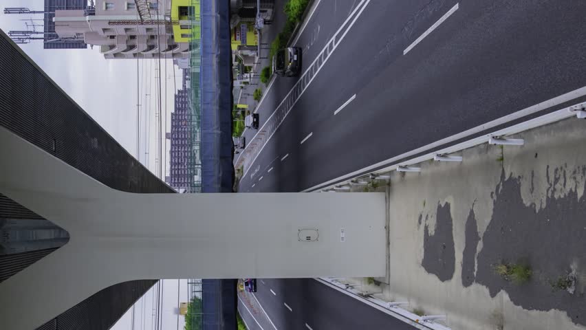 A timelapse of traffic jam at the city street under the highway overpass panning