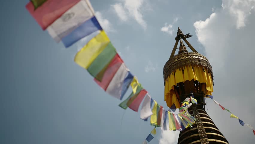 Kathmandu Buddhist Prayer Flags in Nepal at a Buddhist Temple, Close Up Detail of a Gold Stupa and Colorful Tibetan Prayer Flags with Beautiful Architecture and Architectural Details