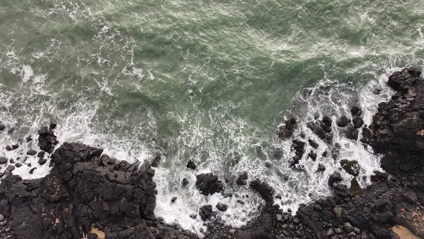 Ocean Waves Crashing onto Rocky Shore in Snæfellsnes Peninsula, Iceland Top Down View