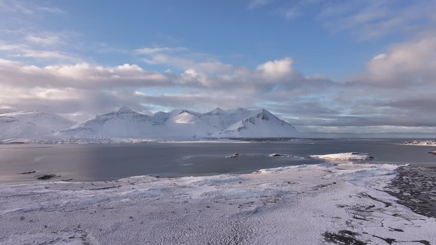Aerial View of Snow-Capped Mountains in Borgarfjörður, Iceland – Scenic Winter Landscape
