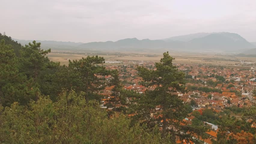 A Beautiful Scenic Overlook with a Woman Gazing Thoughtfully at the Expansive Landscape