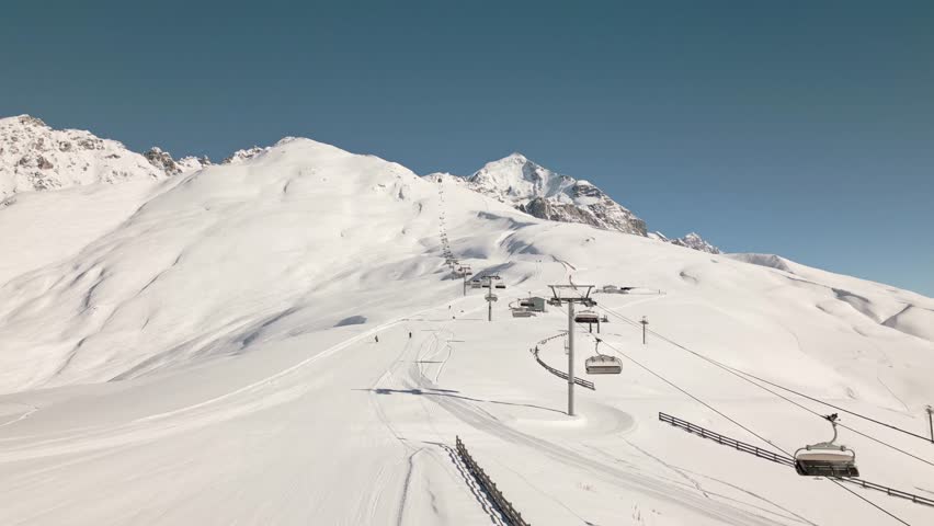 Aerial view of Tetnuldi ski resort in Svaneti region, Georgia, showcasing winter slopes, gondola lifts, and majestic Caucasus mountain scenery. Popular winter ski holiday destination eurasia