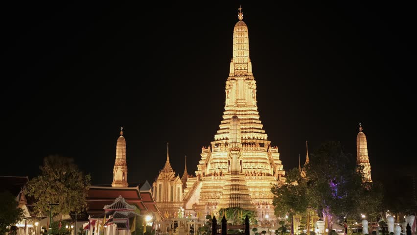 Wat arun temple at night reflects on chao phraya river, creating a mesmerizing spectacle, Bangkok, Thailand. Travel concept.