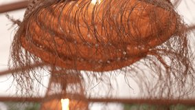 close up of textured rattan pendant light with frayed fiber details - Powered by Shutterstock - Get 15% off with code: PIKWIZARD15