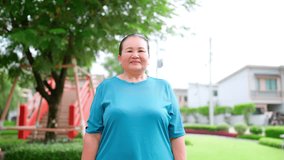 Active senior Asian woman checking fitness data on a smartwatch with a futuristic augmented reality interface while jogging in a park, representing modern health technology and a healthy lifestyle. - Powered by Shutterstock - Get 15% off with code: PIKWIZARD15